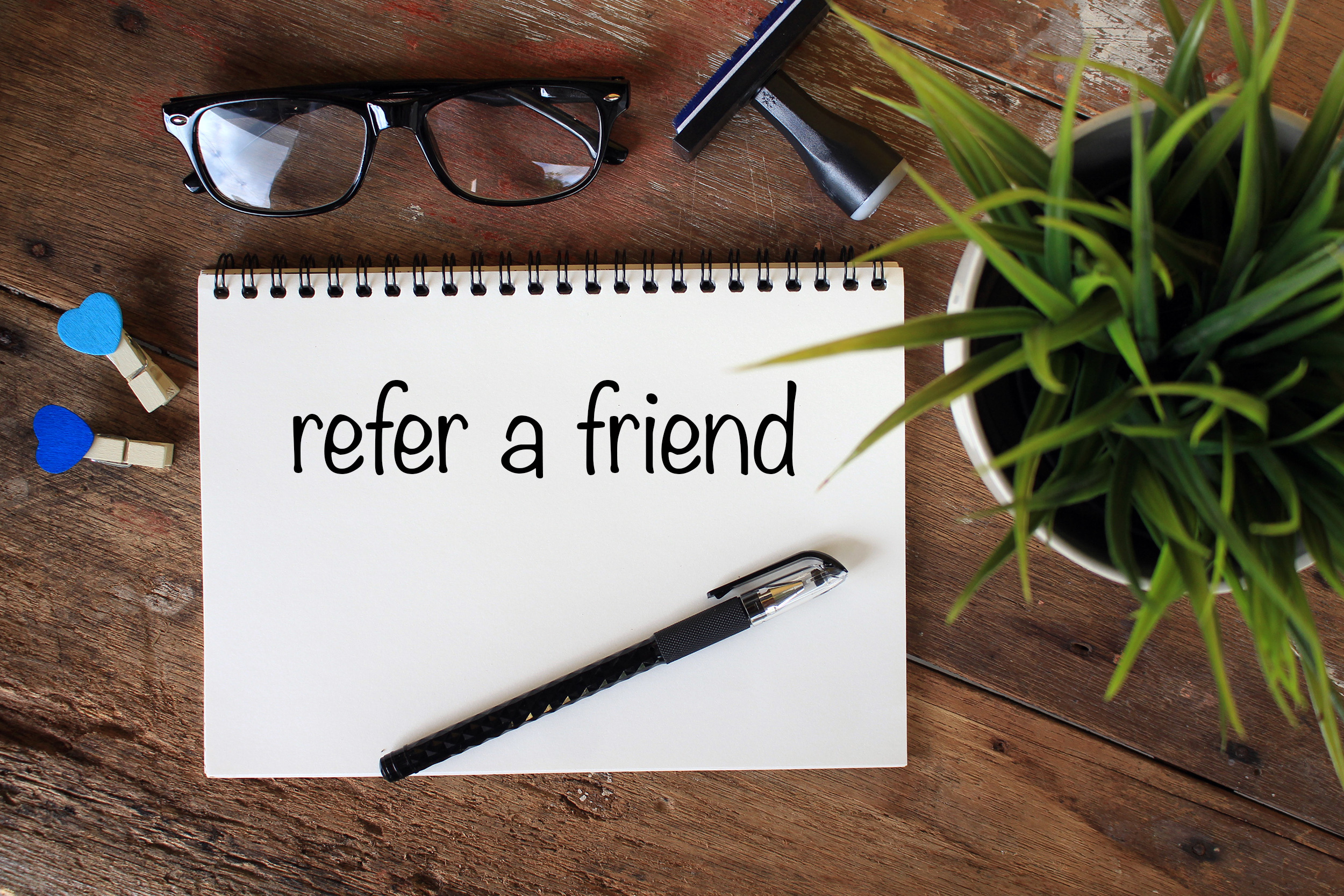 Business,Concept,Top,View,Notebook,Writing,Refer,A,Friend
